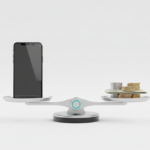 Balanced silver scales with a smartphone on one side and cash on the other, representing a realistic smartphone business income check.