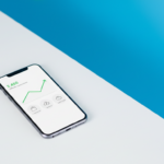 Smartphone displaying affiliate commission dashboard with business apps and rising earnings chart