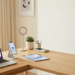 Professional social media manager desk setup with laptop, smartphone, and tablet for content planning.